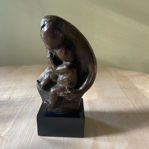 Cast Bronze statue of Mother and baby by Emily Mehling. Signed by the artist.